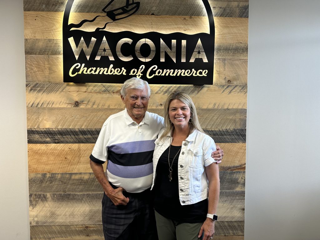 Paul Melchert and Christine Fenner standing in the Waconia Chamber office.