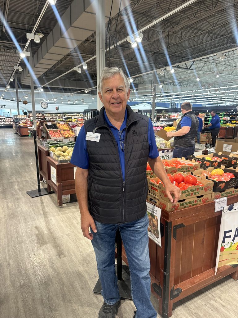 Kim Mackenthun standing inside Mackenthun's Fine Foods