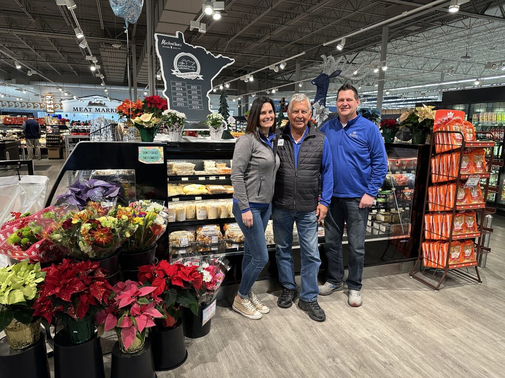 Jess, Kim, and Jaime Mackenthun standing in the grocery store